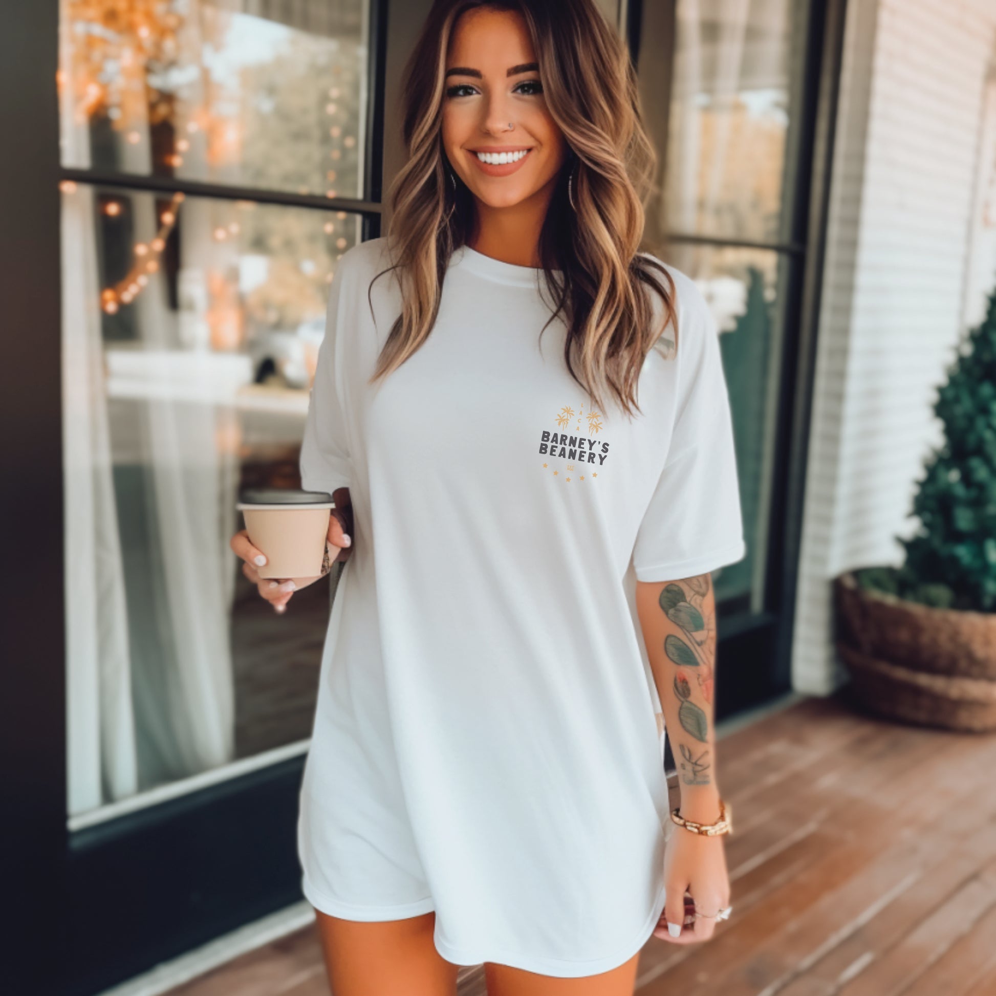 All Roads Lead To | BARNEY'S BEANERY - Women's Graphic Tee | White Bella+Canvas 3001 T-Shirt - Badge Graphic On Front View Of Female Lifestyle Image