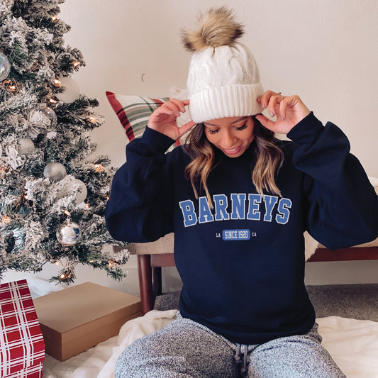 Vintage Collegiate | BARNEY'S BEANERY - Women's Graphic Sweatshirt | Blue Graphics On Navy Gildan 18000 Sweatshirt, Front View Female Lifestyle Image
