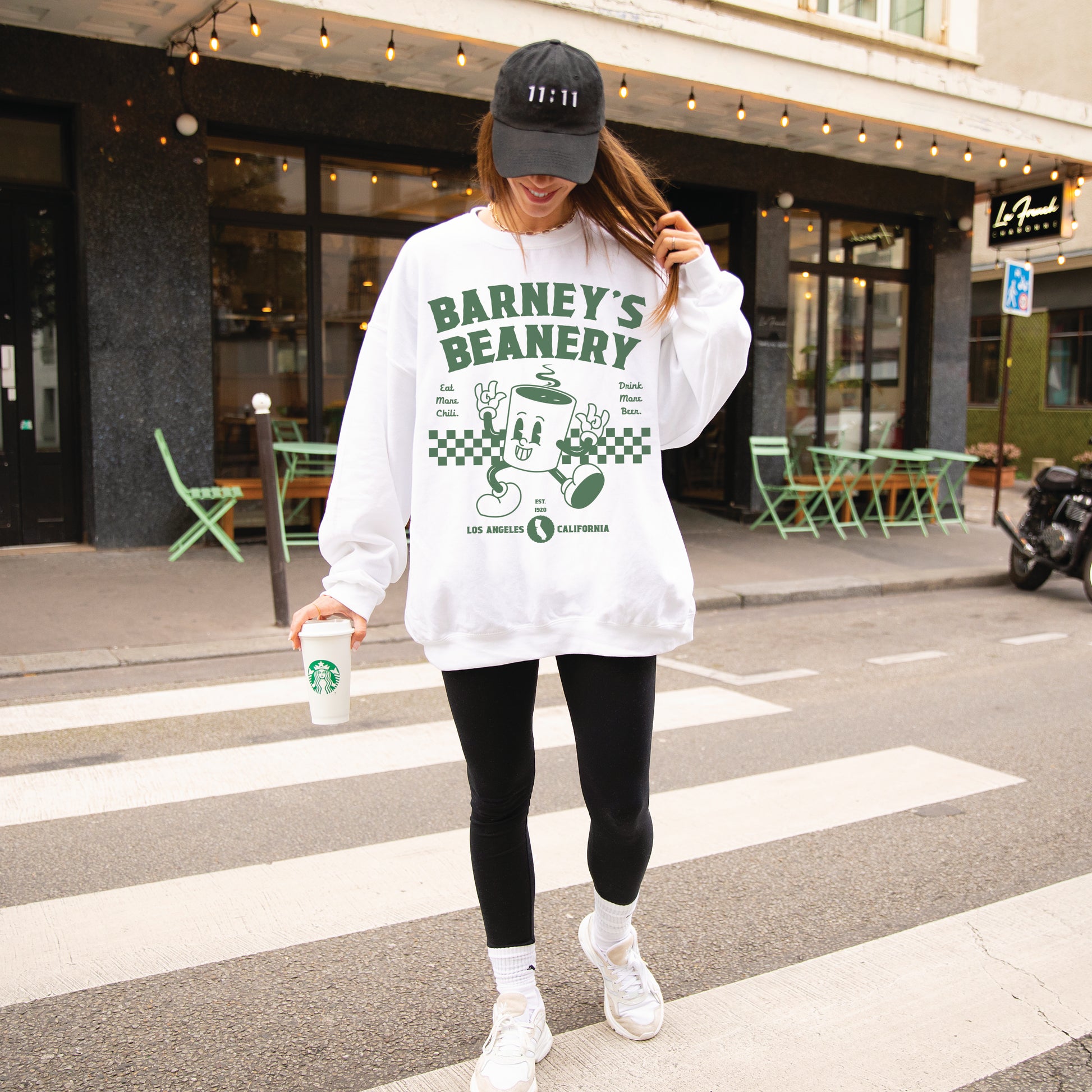 Eat More Chili. Drink More Beer. | BARNEY'S BEANERY Green - Women's Retro Graphic Sweatshirt | Green Graphics On White Gildan 18000, Front View Female Lifestyle Image