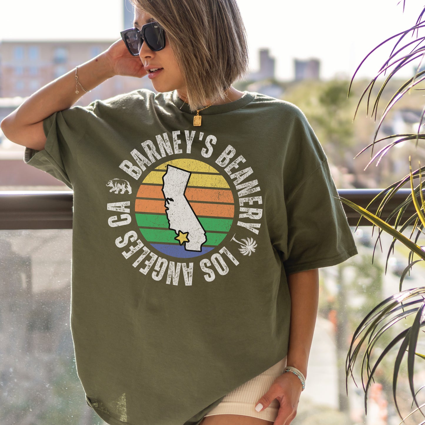 Retro Sunset | BARNEY'S BEANERY - Women's Retro Graphic Tee | Military Green Gildan 5000 T-Shirt, Front View Female Lifestyle Image