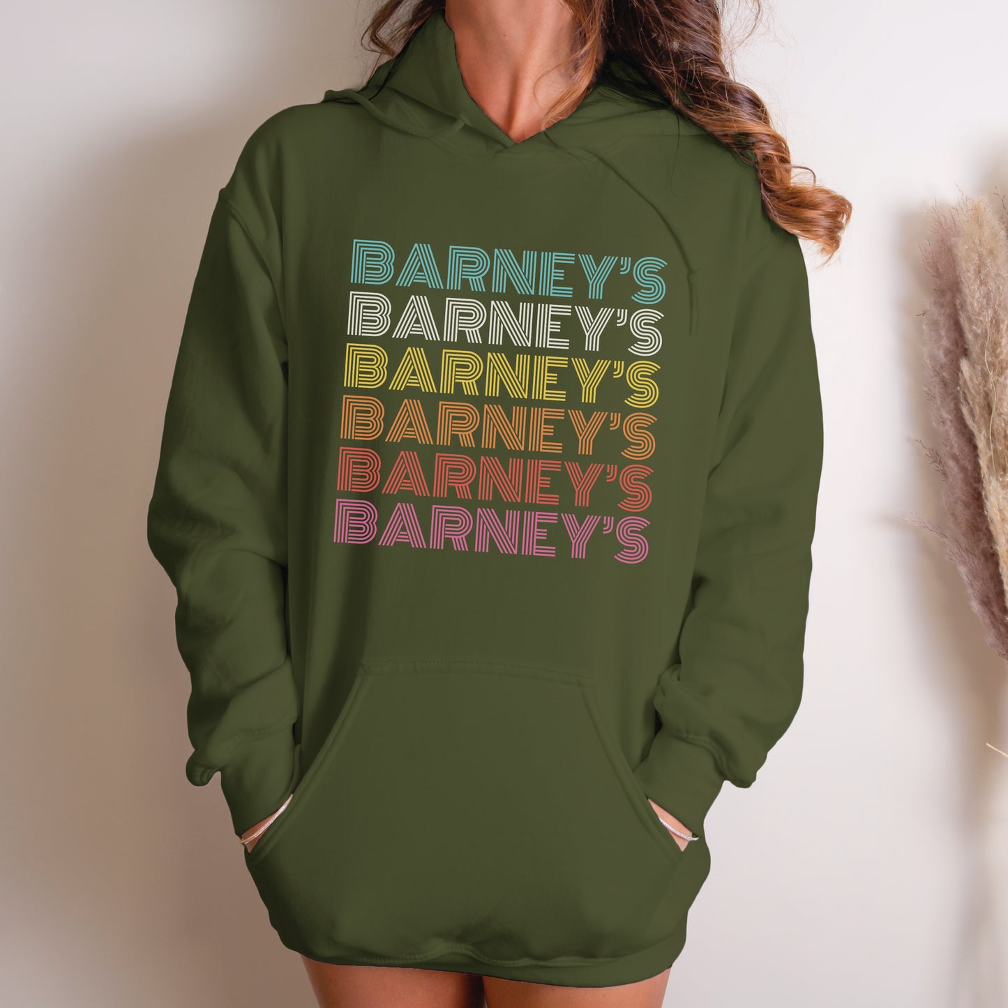 Barney's x6 Retro Hollywood | BARNEY'S BEANERY - Women's Retro Graphic Hoodie | Rainbow Retro Graphics On Military Green Gildan 18500 Hoodie, Front View Female Lifestyle Image