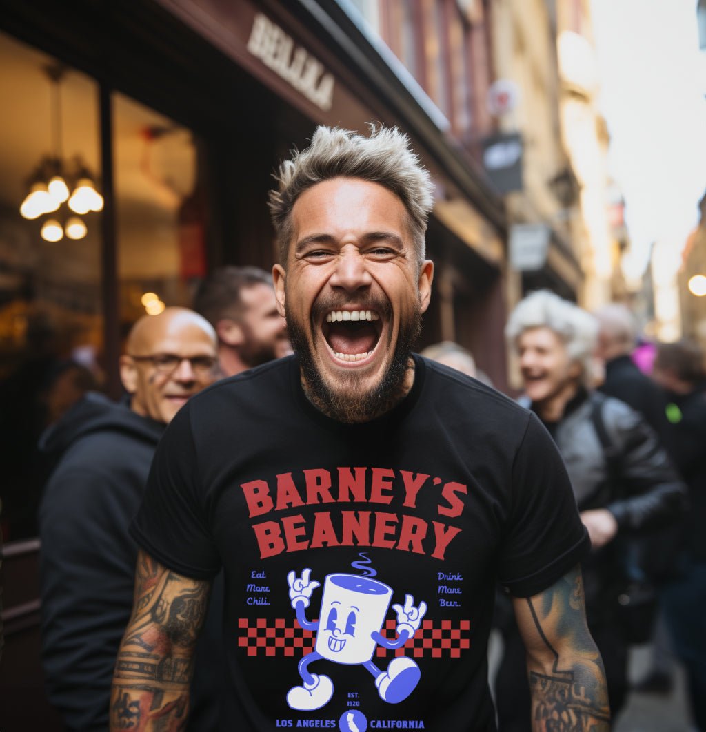 Eat More Chili. Drink More Beer. | BARNEY'S BEANERY - Men's Retro Graphic Tee | Black Bella+Canvas 3001 T-Shirt - Big Red & Blue Graphic On Front View Of Male Lifestyle Image